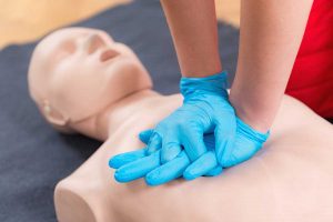 First Aid Training - Cardiopulmonary resuscitation. First aid course on cpr dummy.